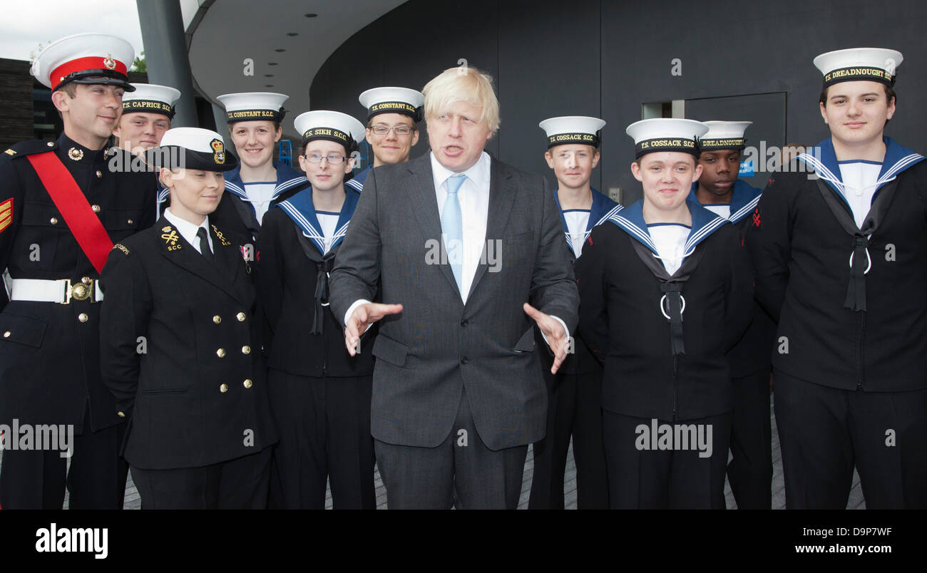 London, UK. 24 June 2013. Pictured: Boris Johnson with Sea Cadets. The Mayor of London, Boris Johnson, was today joined by members of the London Assembly, Chelsea Pensioners, the Royal Navy, Army and RAF to honour the bravery and commitment of the Armed Forces in a flag raising ceremony at City Hall, London. The Armed Forces flag was raised ahead of the Armed Forces Day on 29 June. Photo: Nick Savage/Alamy Live News Stock Photo