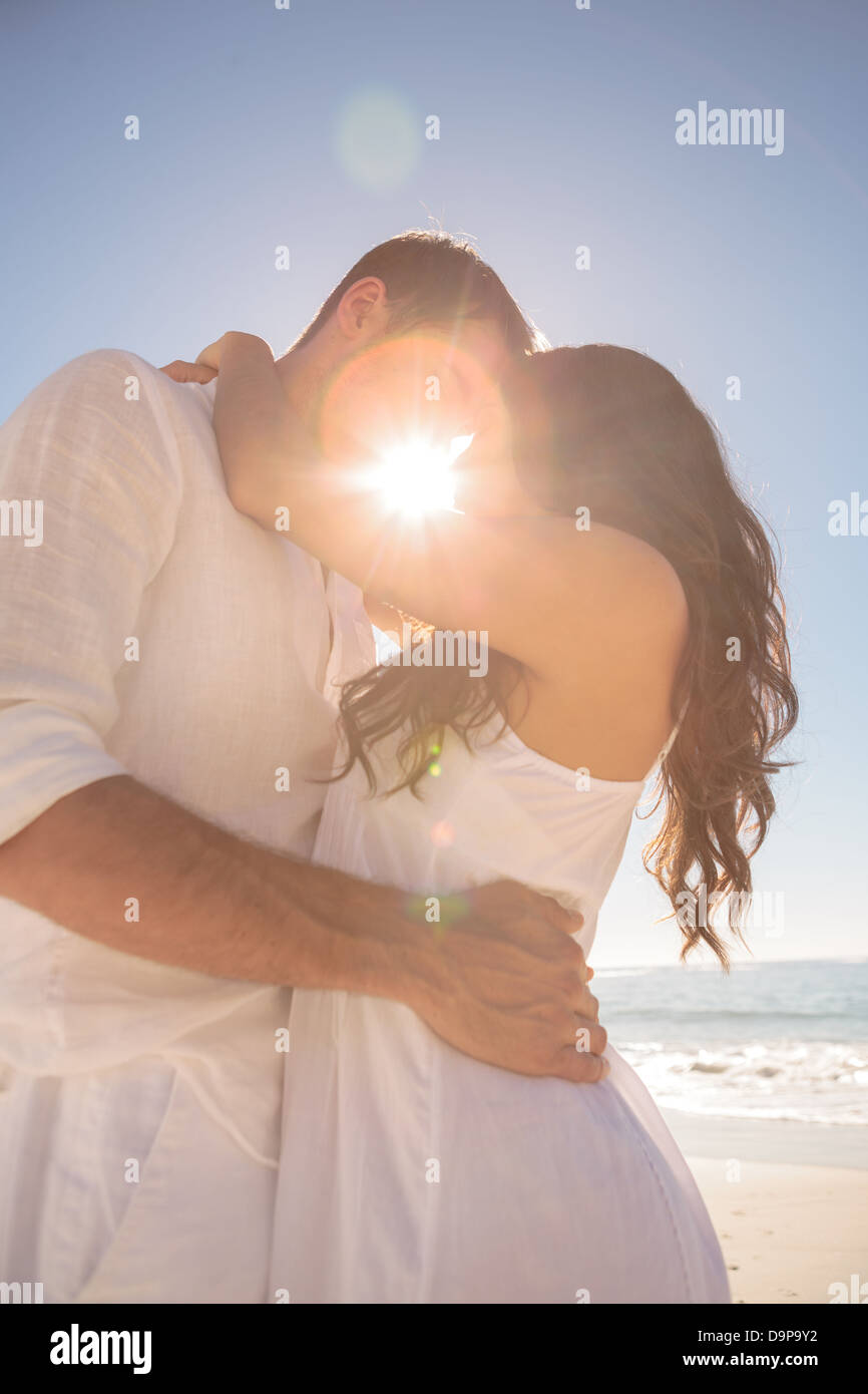 Couple kissing on the beach Stock Photo