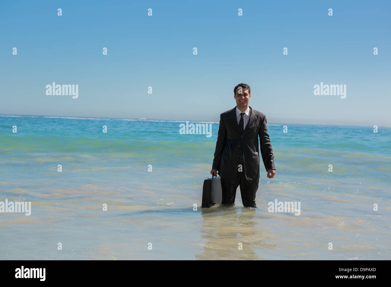 Businessman beach ocean suit hi-res stock photography and images - Alamy