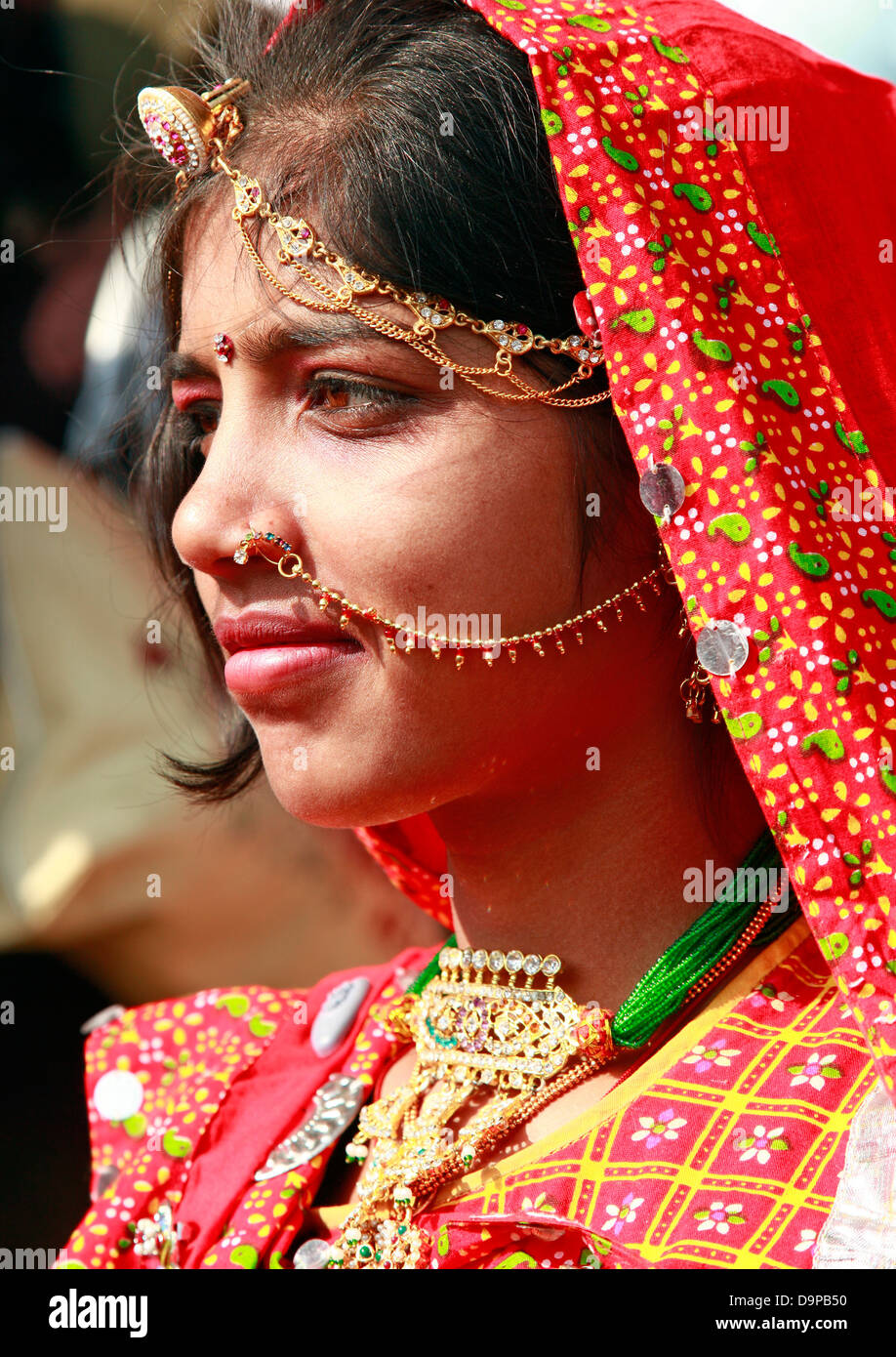Free Photos - A Woman Wearing A Green Indian Dress, Possibly A Bridal  Outfit, Complete With Traditional Jewelry And Accessories. She Has Her Hair  Styled In A Braid, Enhancing Her Graceful Appearance.