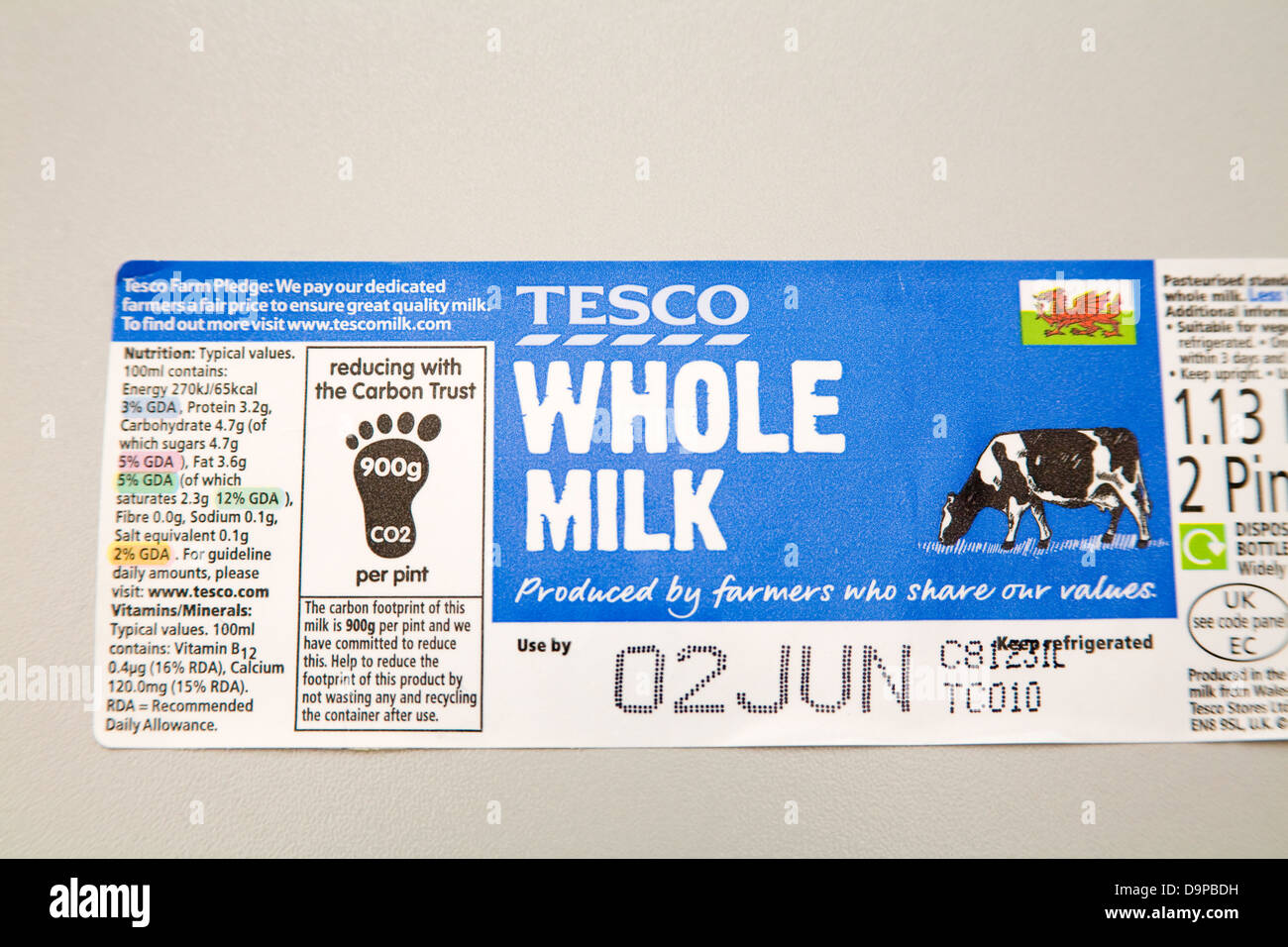 Label from Tesco whole milk trying to reduce carbon footprint Stock Photo