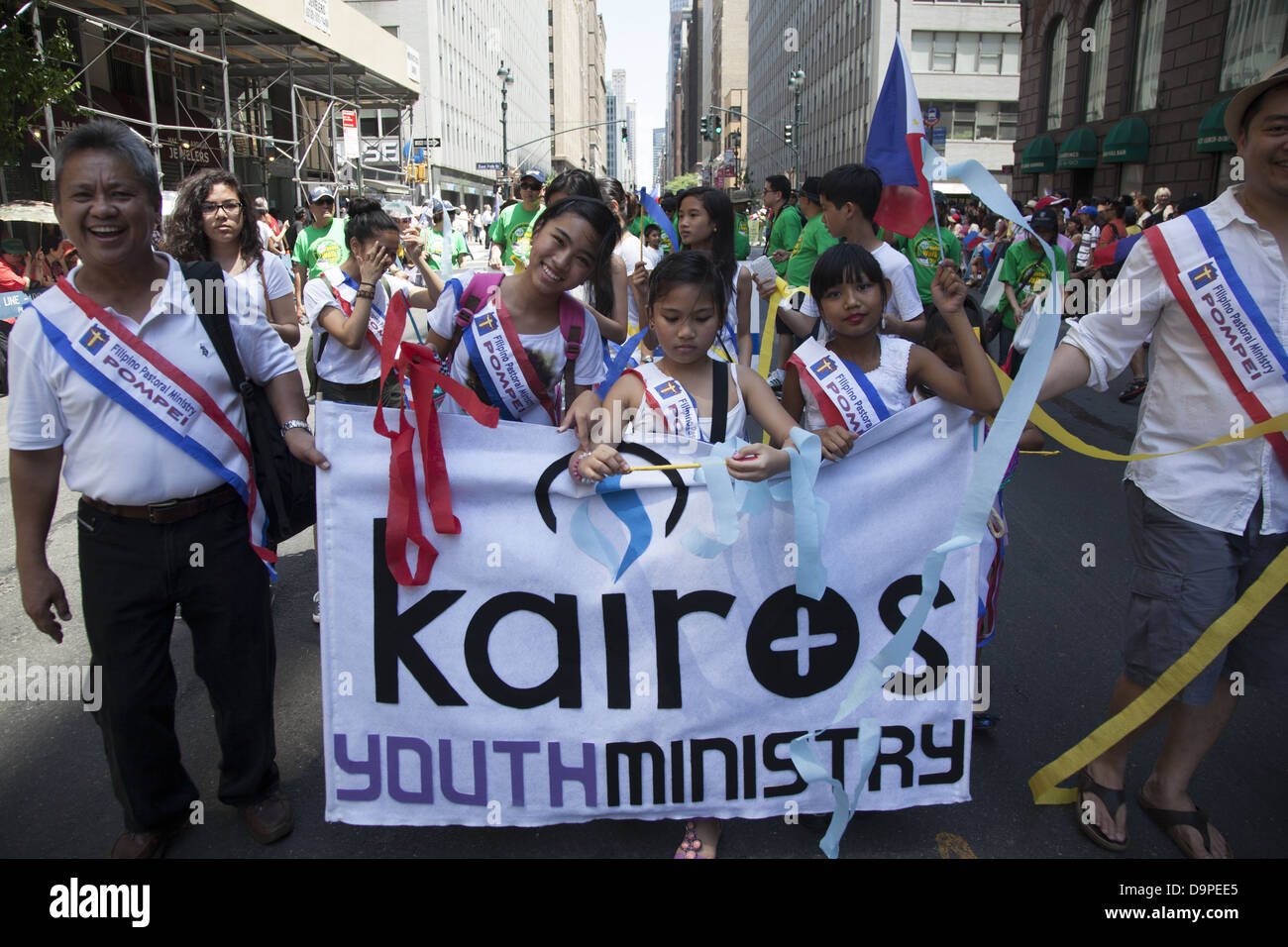 Children from a religious organization march in the Filipino Parade in New York City. Stock Photo