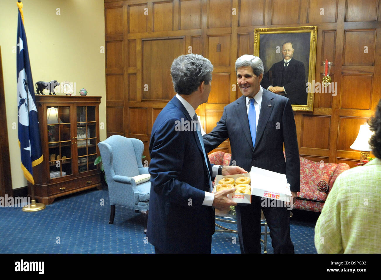 Secretary John Kerry Delivers Dunkin' Donuts to His Brother, Acting Commerce Secretary Cameron Kerry, and His Staff Stock Photo
