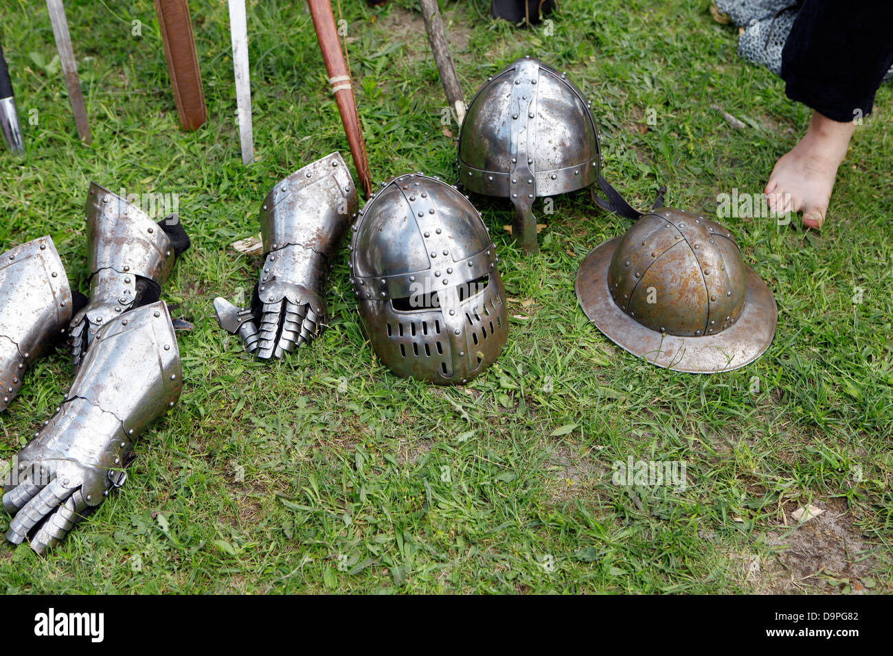 Medieval knights helmet with visor outdoors with accessories in the