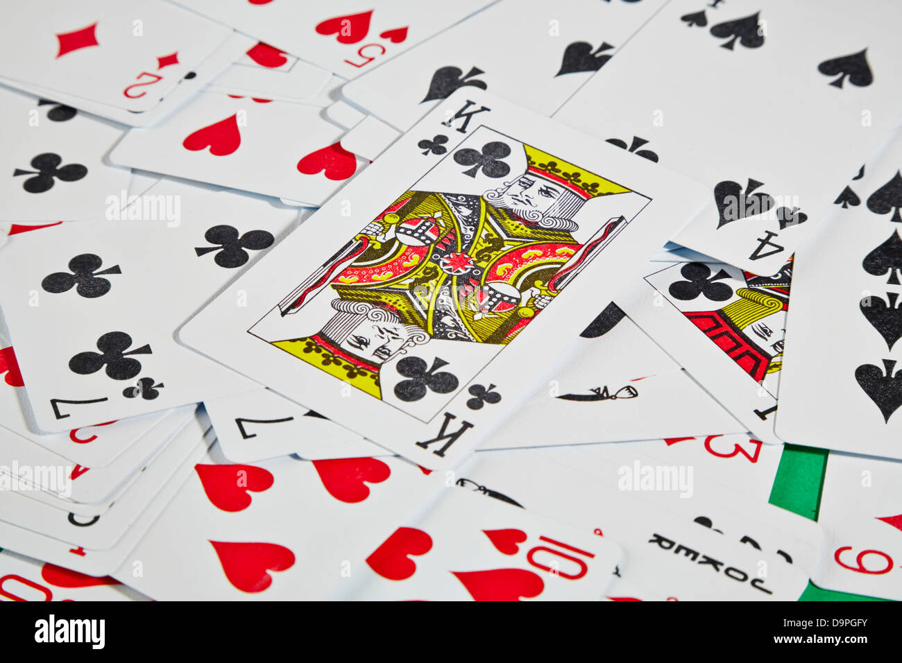 King card on top of other playing cards on table Stock Photo Alamy