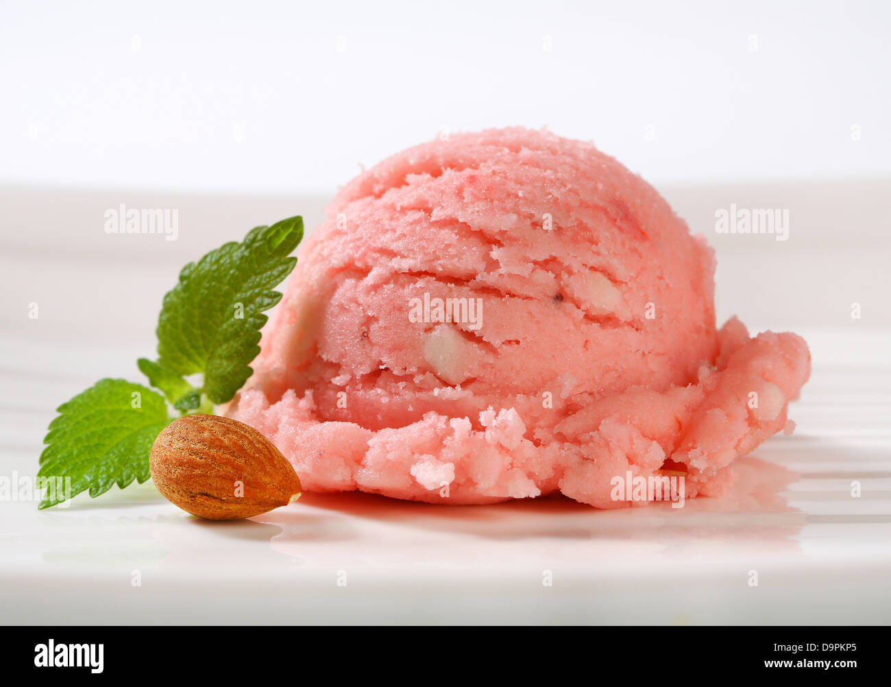 Scoop of pink fruit sherbet Stock Photo - Alamy