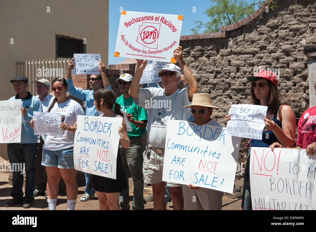 Tucson, Arizona, USA. 24th June, 2013. Tucsonans representing several human rights and environmantal groups including Derechos Humanos, No More Deaths and the Sierra Club spoke to media at a downtown Tucson, Ariz. shrine calling for the Senate to vote down the Corker-Hoeven amendment to the Comprehensive Immigration Reform Bill this afternoon. Speakers said that the amendment will only further militarize the border, cause more migrant deaths and further strain the national budget. The Corker-Hoeven amendment calls for the construction of 700 miles of border fence, as well as roughl Stock Photo