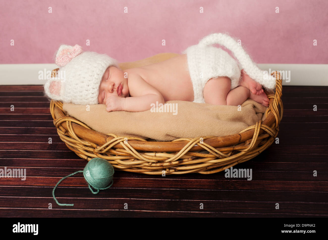 Newborn Baby in Kitten Costume Stock Photo