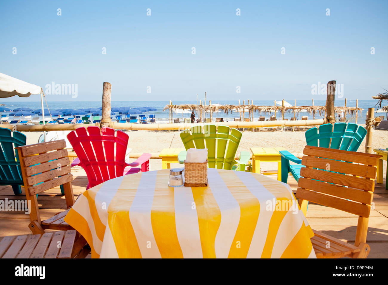 Colorful seaside table and chairs Stock Photo