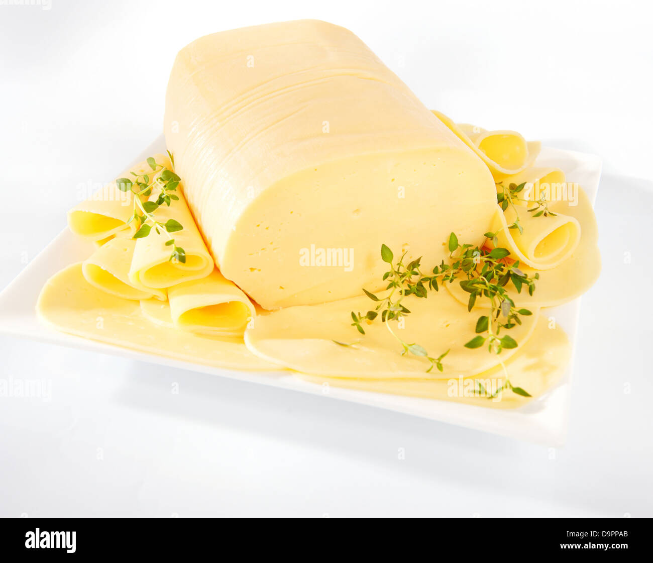 Fresh yellow gouda cheese on a plate Stock Photo Alamy