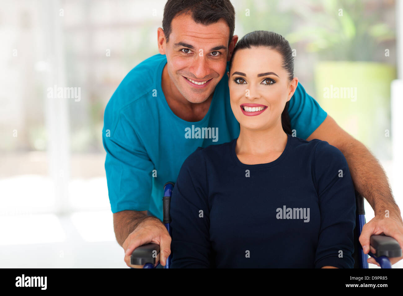 loving husband and disabled wife closeup portrait Stock Photo