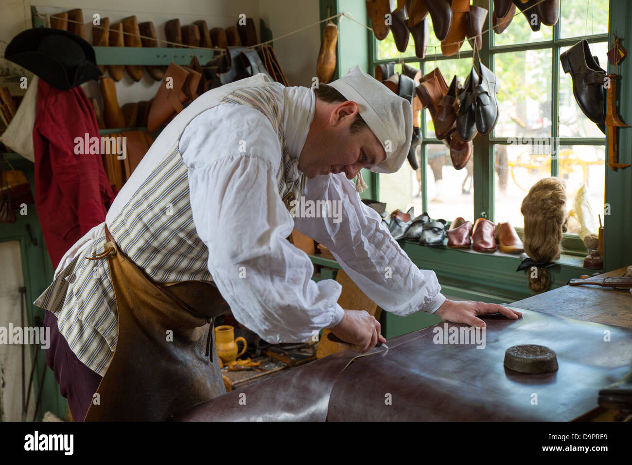 Shoe maker at Colonial, Williamsburg, Virginia, USA Stock Photo