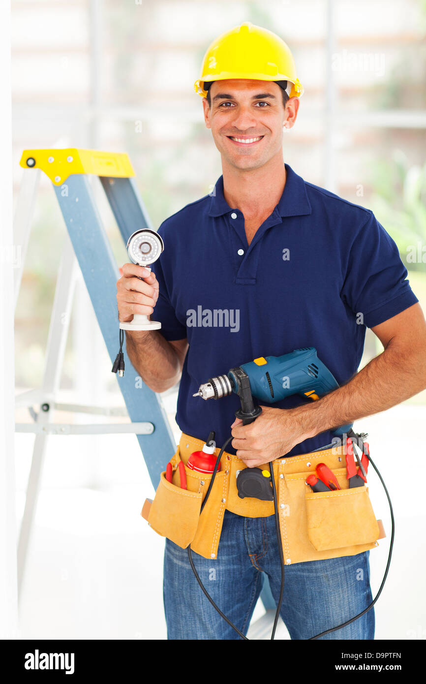 Security surveillance system installer with cctv camera and tools stock photo alamy