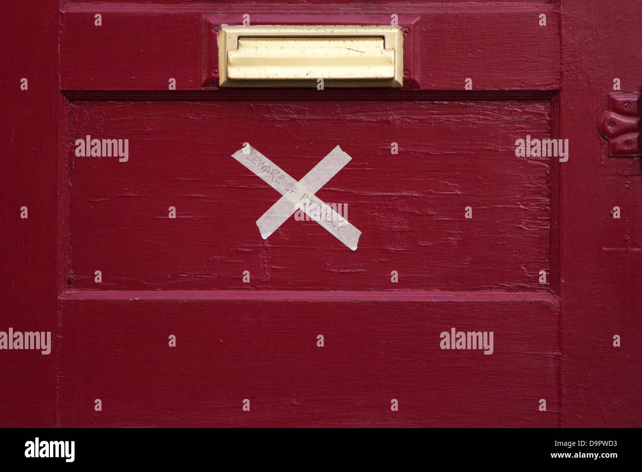 Saturday, June 22, 2013. An X on the door of this residence in Calgary, Alberta, Canada tells emergency personnel that the home has been evacuated.  A state of emergency in the city and mandatory evacuation orders  for this Sunnyside neighbourhood remain in place after heavy rains caused severe flooding in the city. Stock Photo