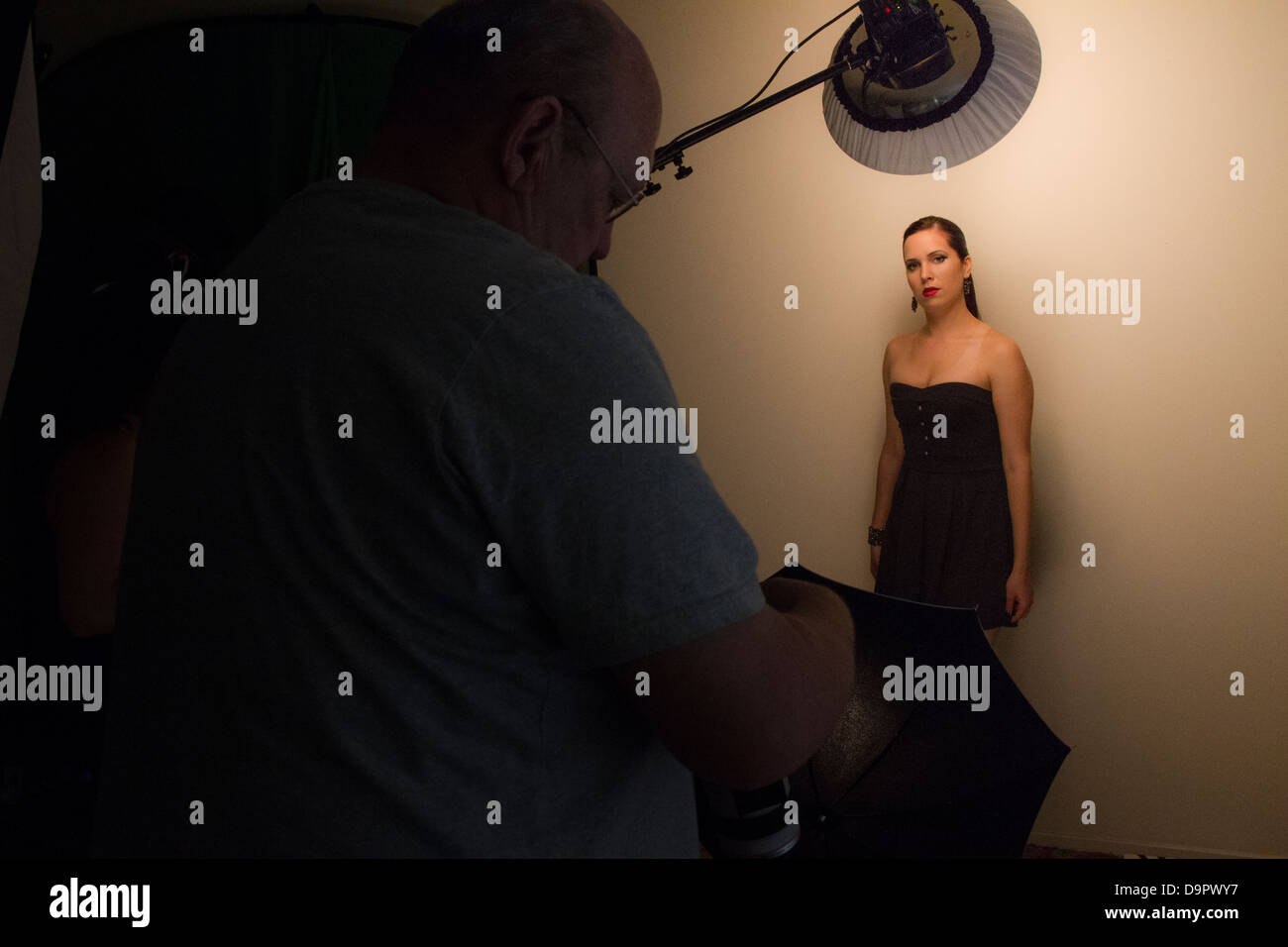 A model posing during a photo shoot Stock Photo - Alamy