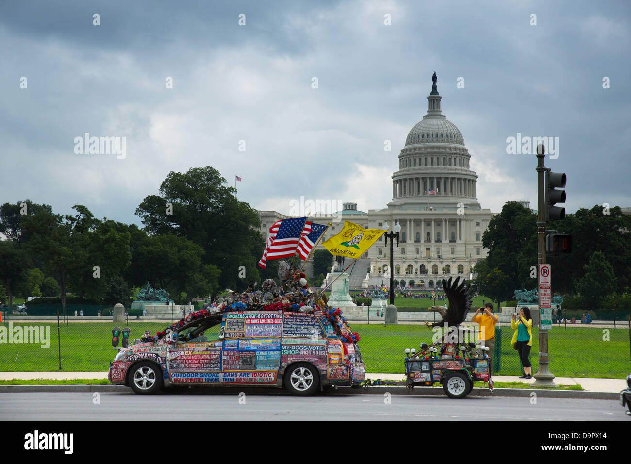 Tourists take photos of van covered in political messages in front of US Capitol building, Washington D.C., USA Stock Photo