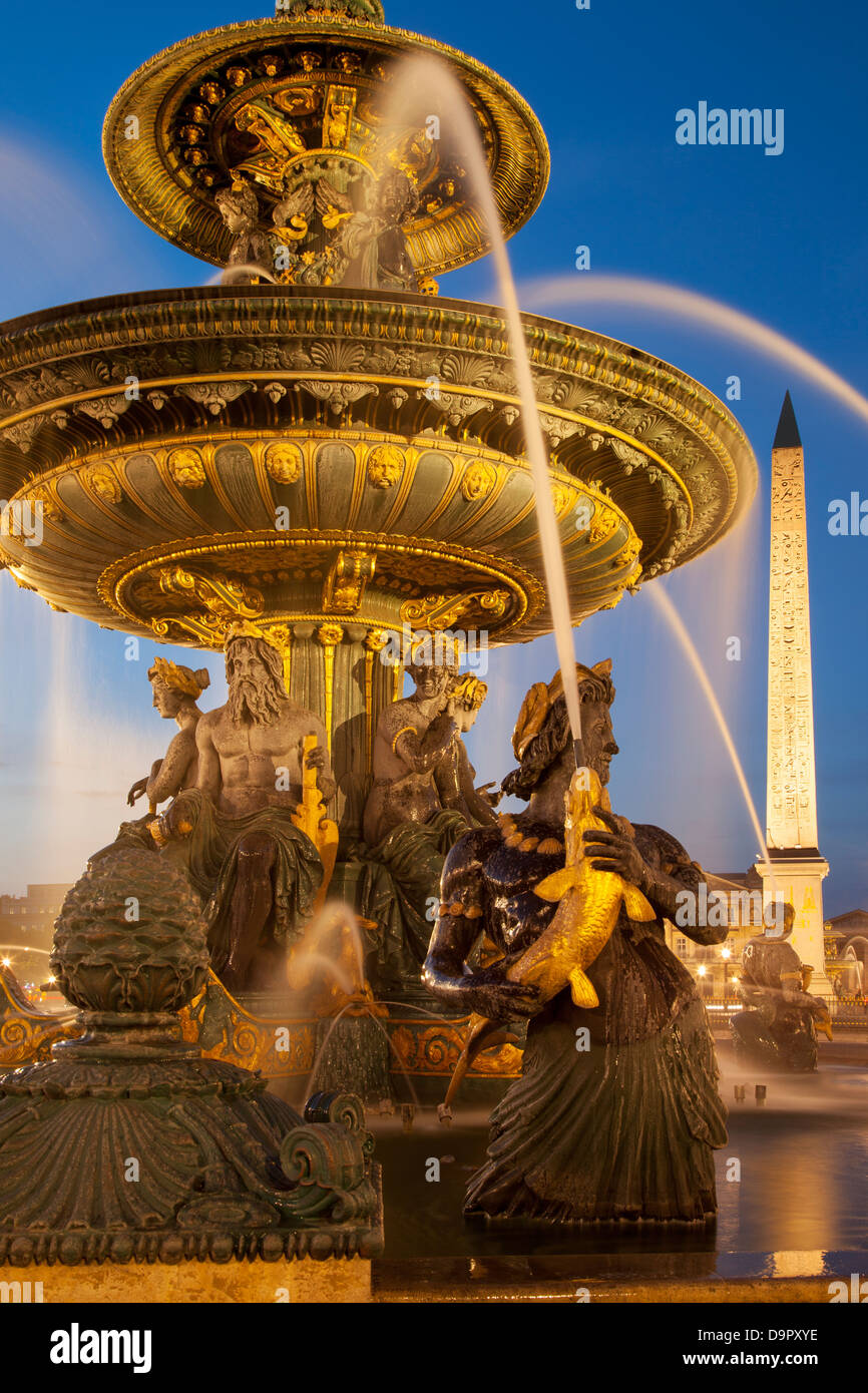 Twilight at Fontaine des Mers - Fountain of Seas in Place de la Concorde, Paris France Stock Photo