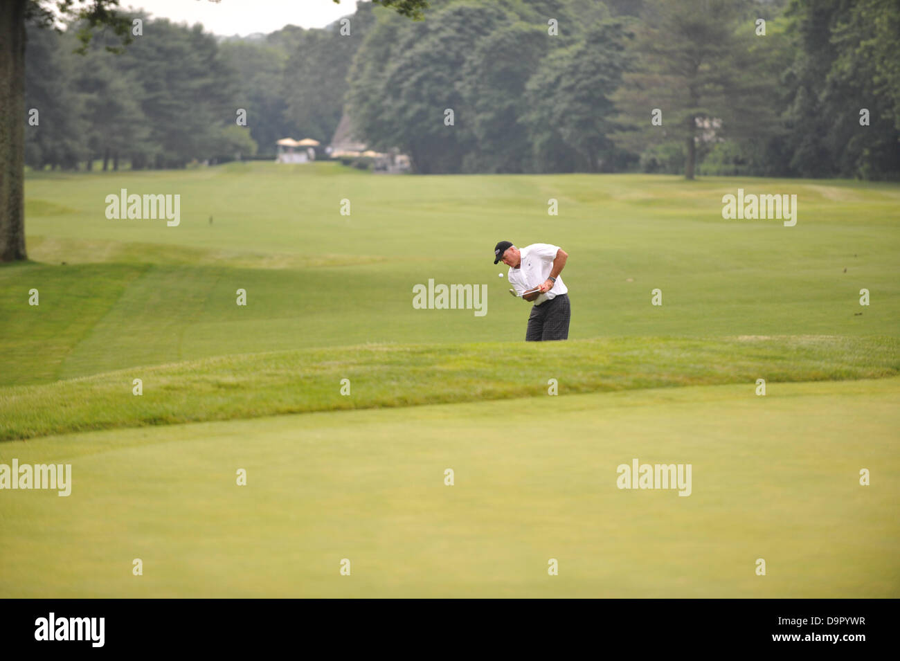 Huntington, N.Y, U.S. June 24, 2013.  Former NFL quarterback Neil O'Donnell chips onto the green during the second annual Big Daddy Celebrity Golf Classic at Cold Spring Country Club in Huntington, N.Y. Credit:  Cal Sport Media/Alamy Live News Stock Photo