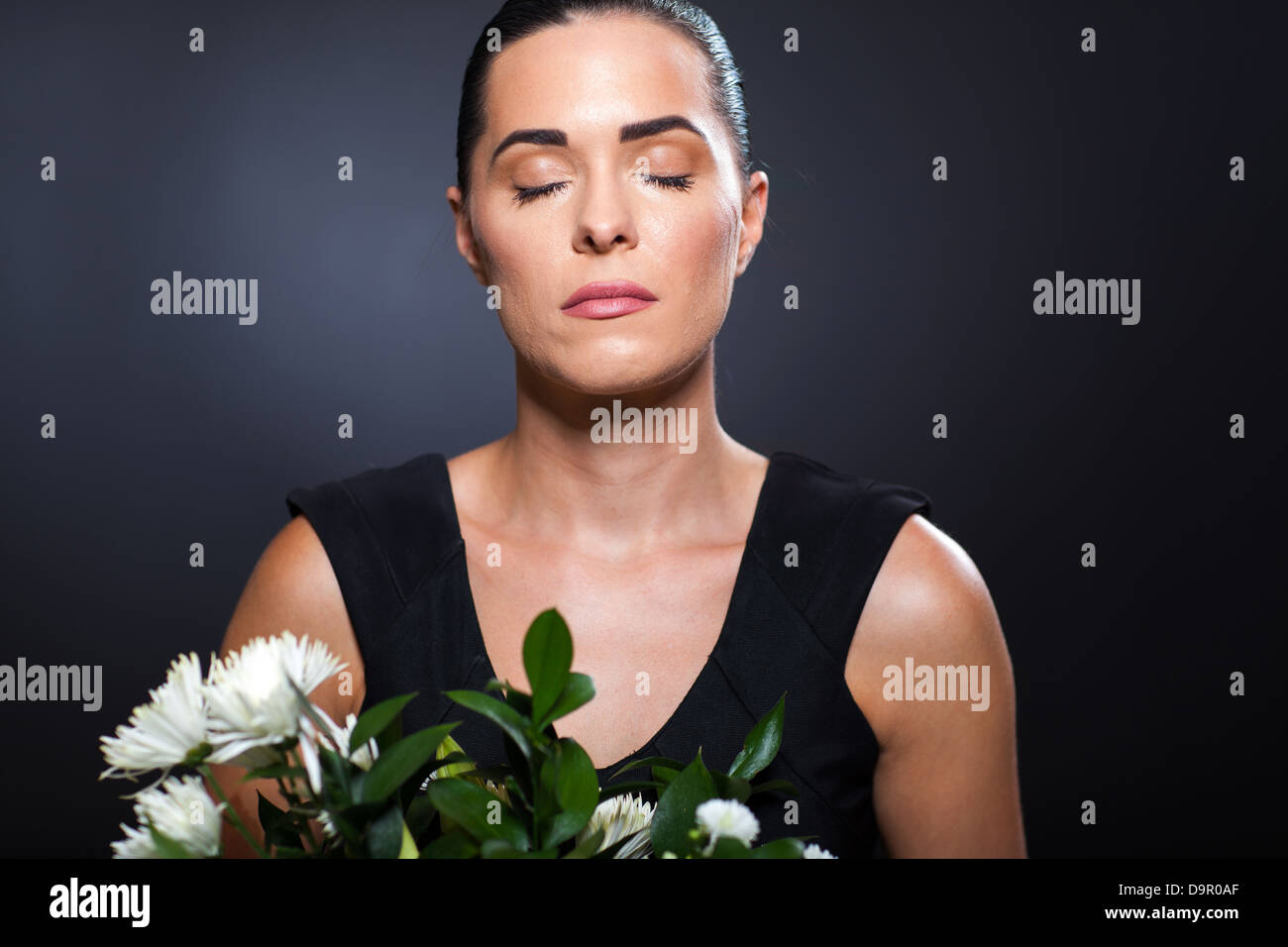 sad young woman in sorrow with tears on her face Stock Photo