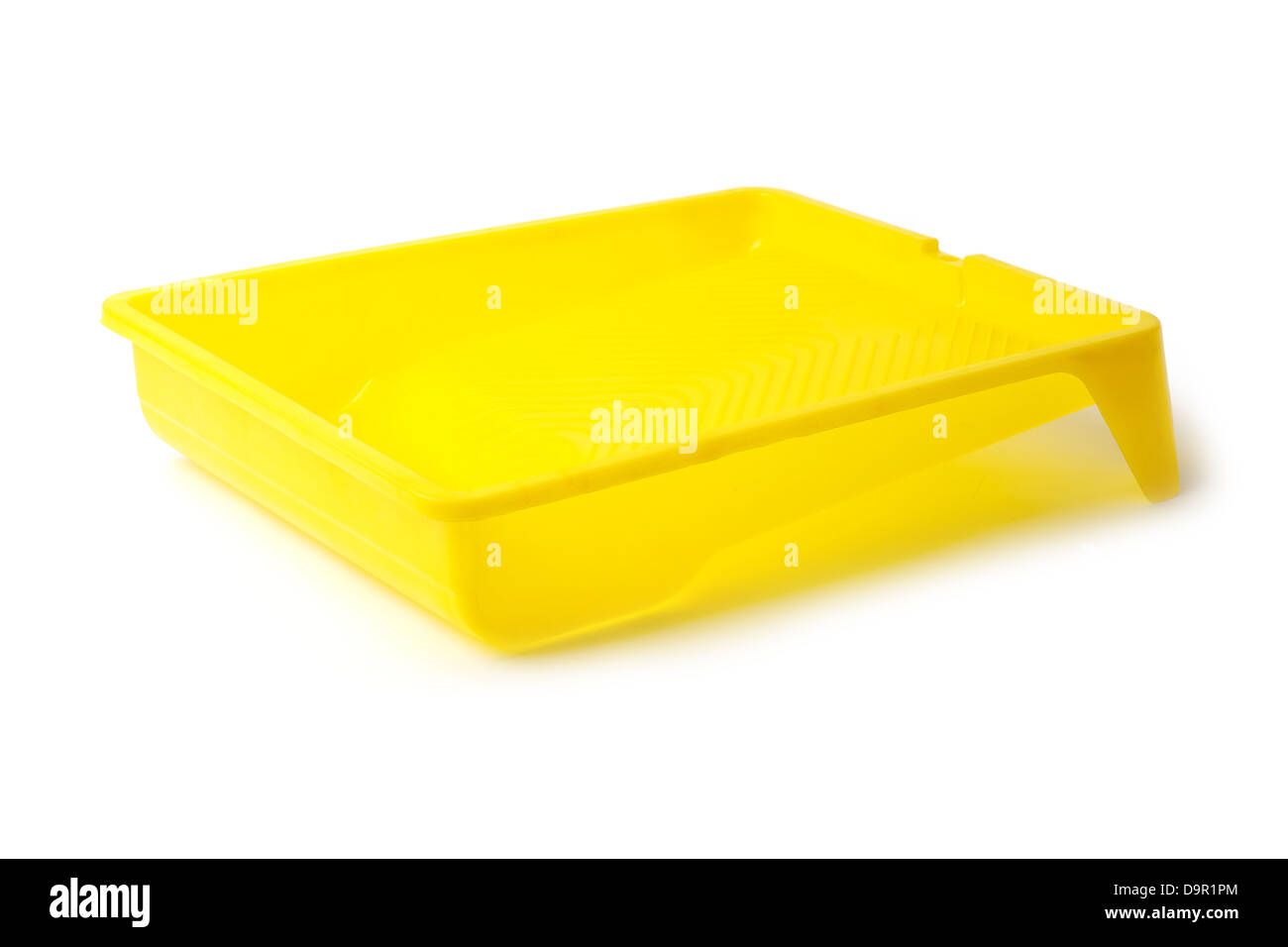 yellow Paint tray isolated on black background Stock Photo