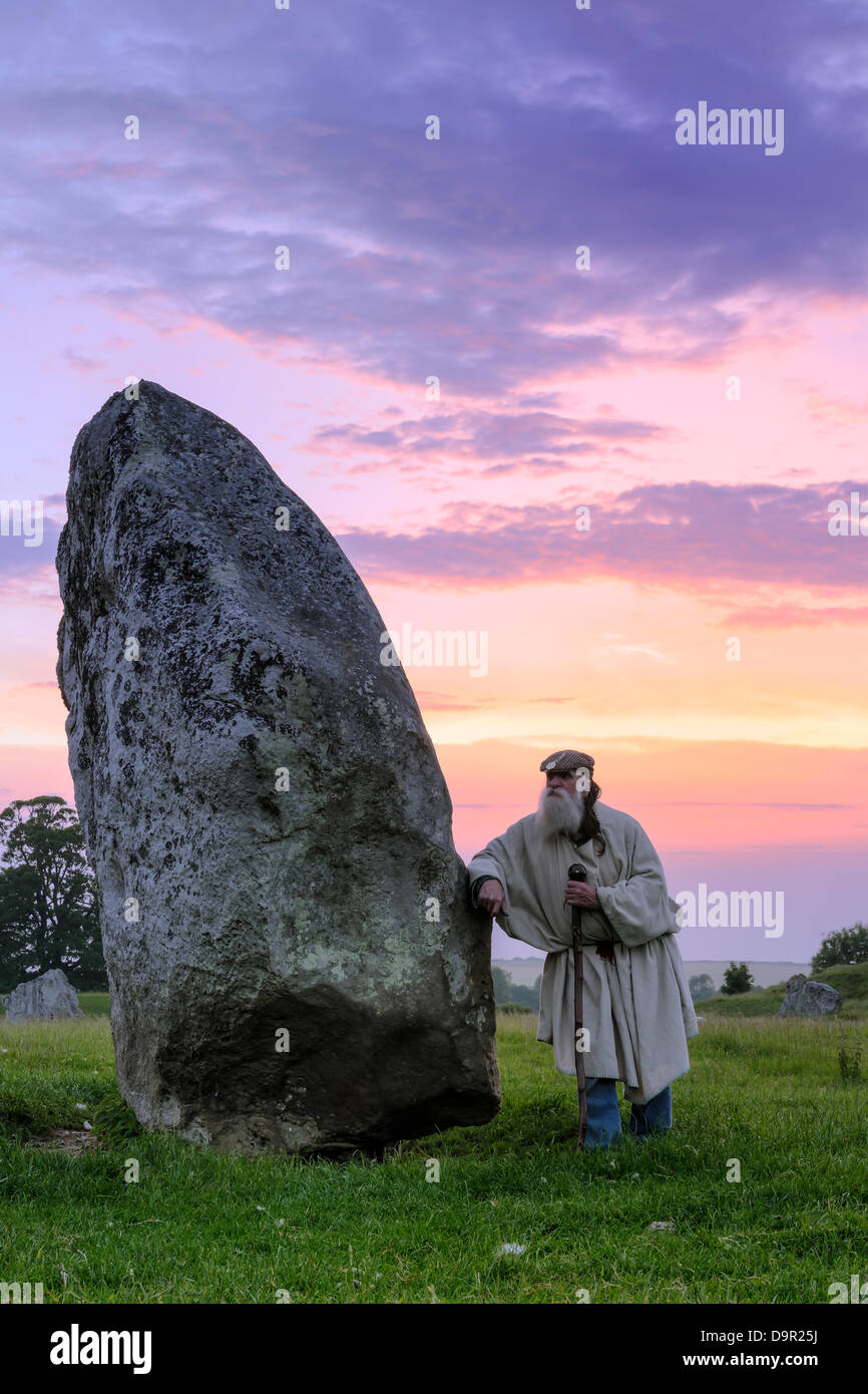 Terry, 'The Keeper of the Stones' - Leaning against the 'BrokenHeart Stone' - Avebury, Wiltshire June 19th 2013. Stock Photo