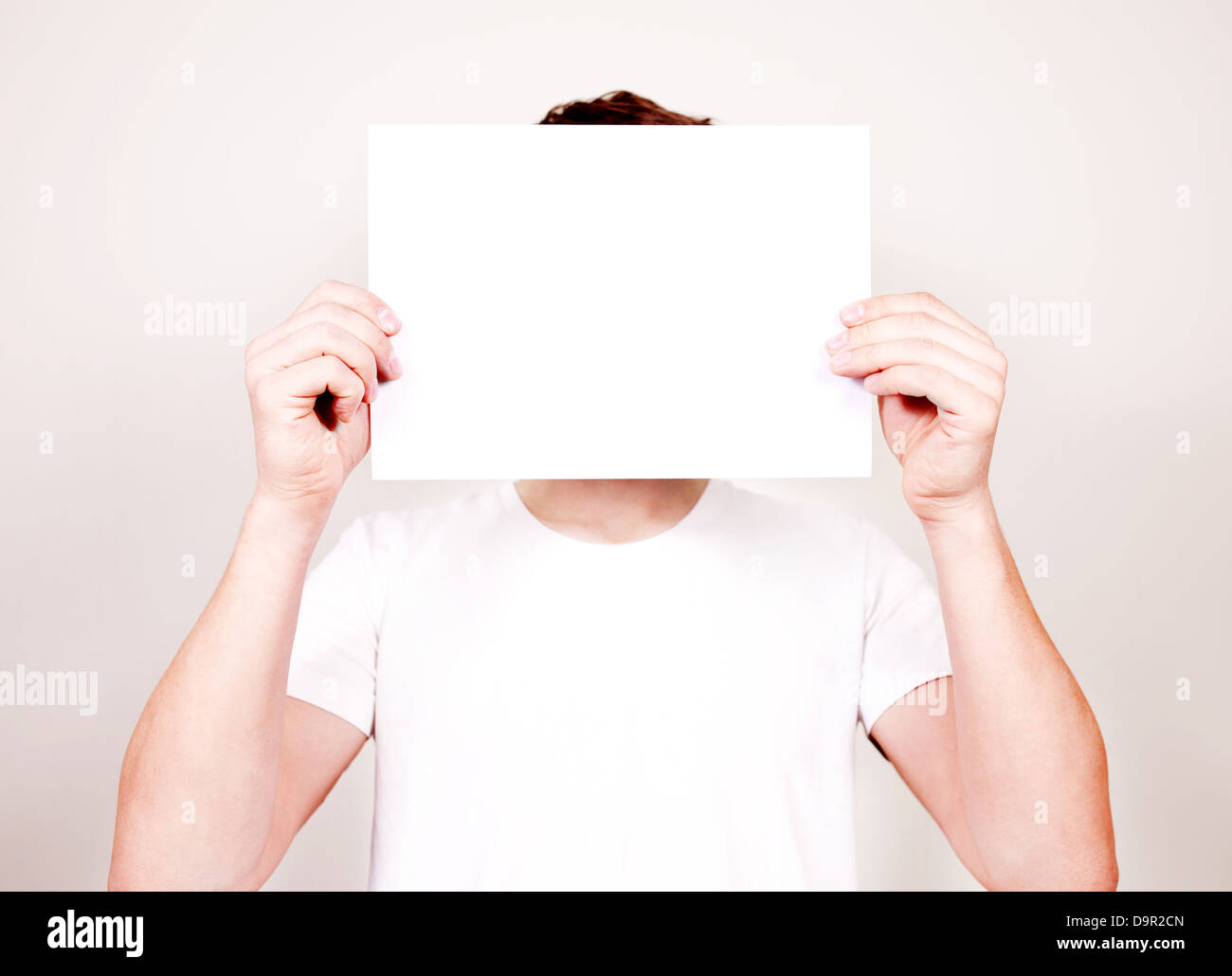 Man holding blank sign in hands Stock Photo