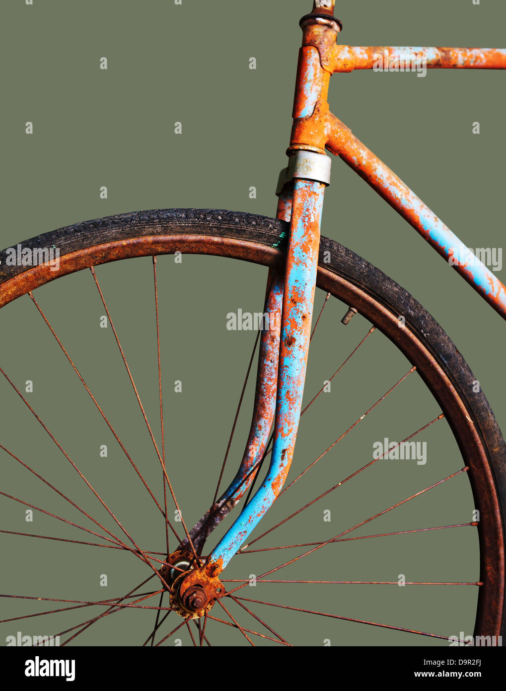 Old rusty bicycle, isolated on green Stock Photo