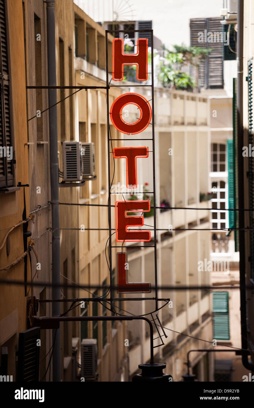 Red neon Hotel sign in old town Stock Photo