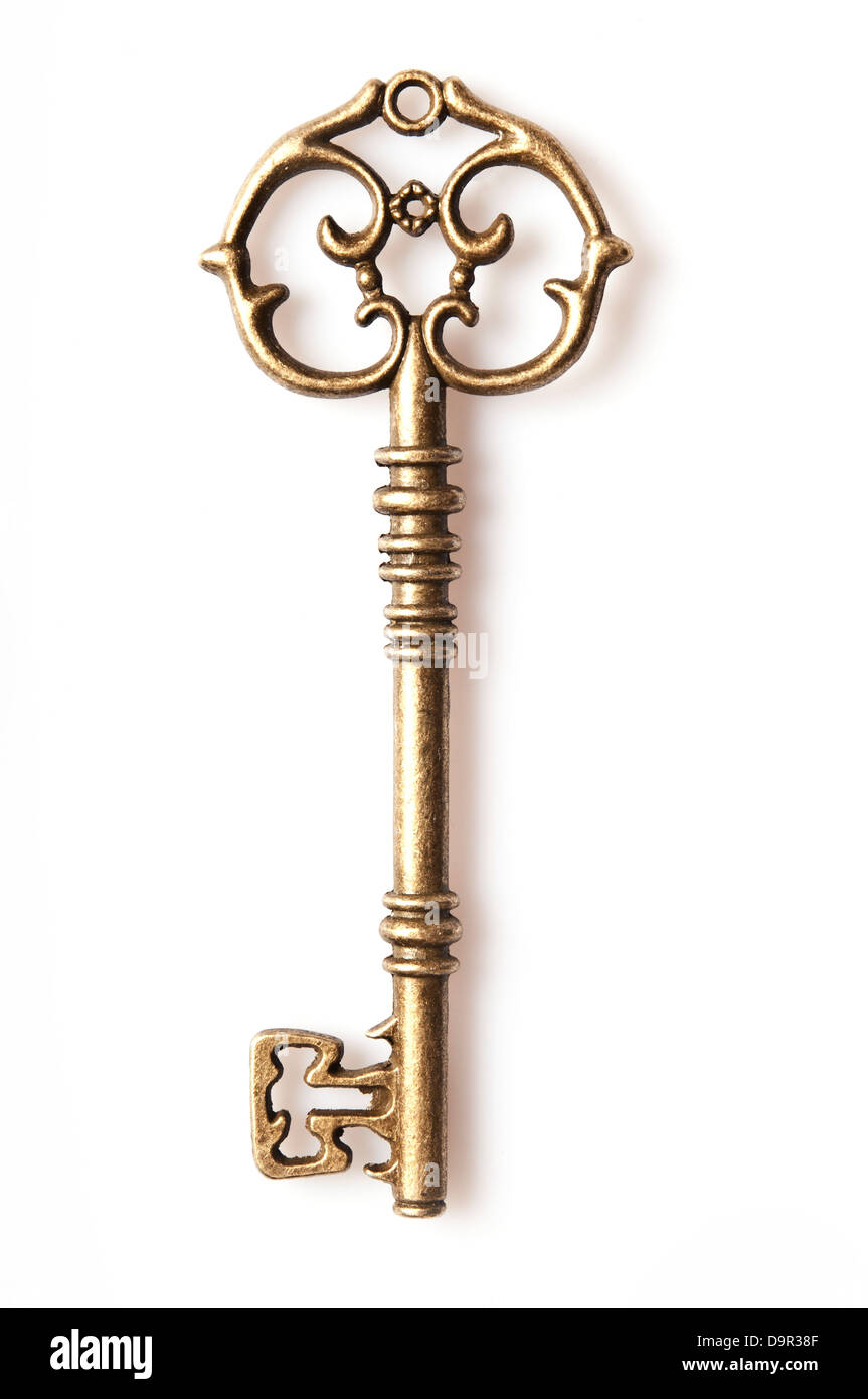 ornate antique golden skeleton key, isolated Stock Photo