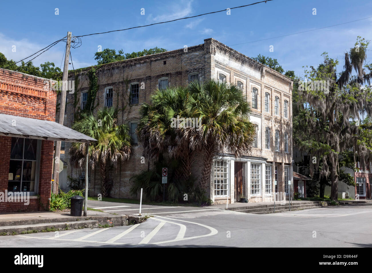 Old antique shop in a three-story brick commercial building in the historic district of Micanopy, Florida. Stock Photo