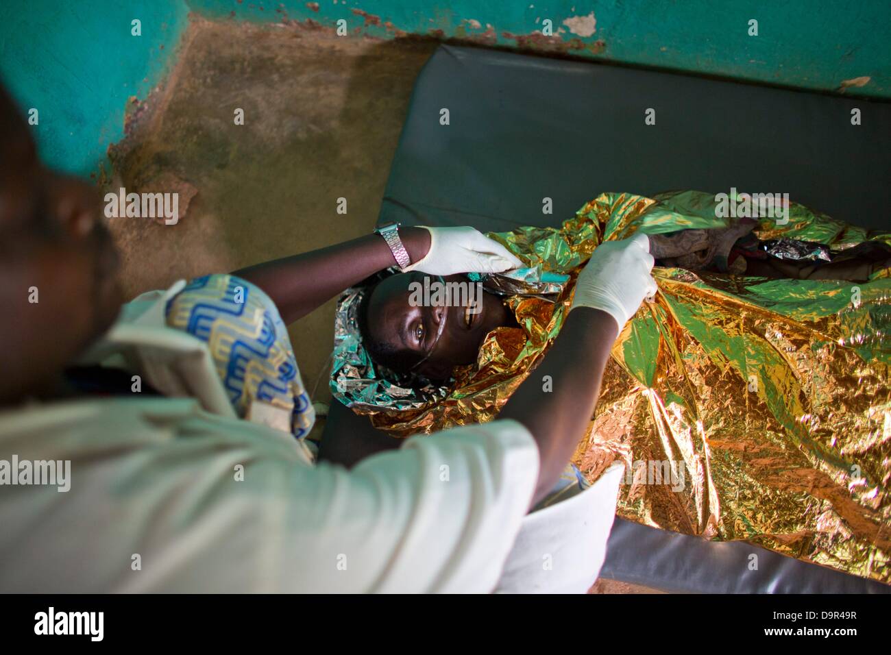 HIV aids patient wrapped in alluminium foil to keep warm in hospital in ...
