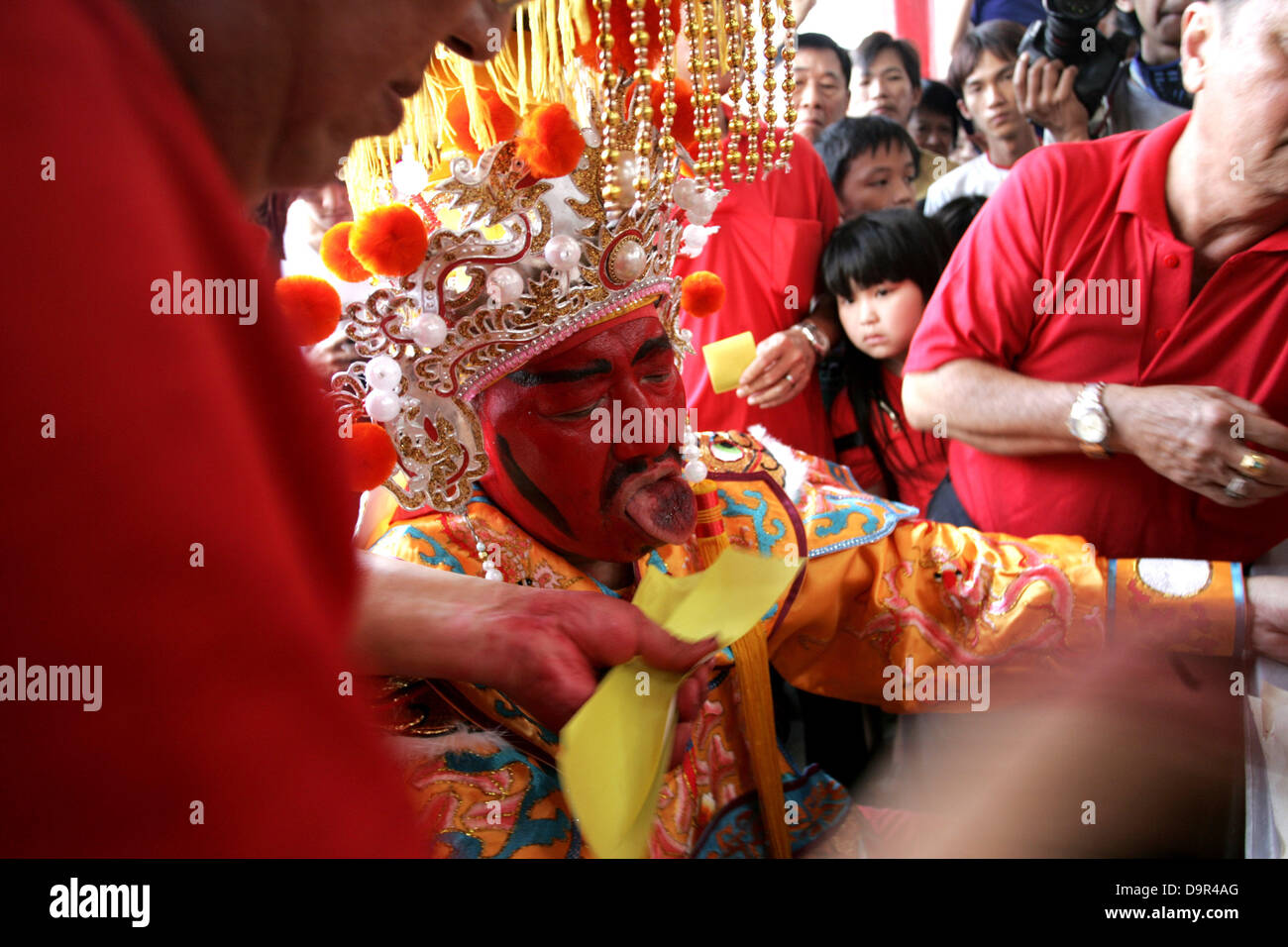 June 20, 2013 - BINTAN, INDONESIA JUNE 25, 2013 : Photo Taken June 20, 2013, A resident possessed and become Kwang Ti Kong god or Guan Yu god the anniversary of his birth on June 20, 2013 in the 3 temple, Bintan, Indonesia. Kwang Ti Kong played a significant role in the civil war that led to the collapse of the Han Dynasty and the establishment of the state of Shu Han in the Three Kingdoms period, of which Liu Bei was the first emperor..As one of the best known Chinese historical figures throughout East Asia, Guan's true life stories have largely given way to fictionalised ones, most of which  Stock Photo