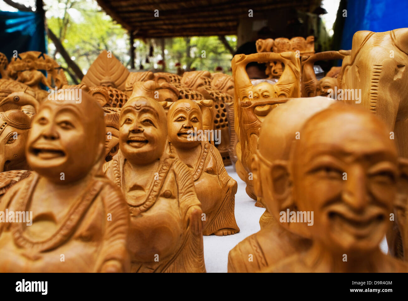Statues of Laughing Buddha for sale at souvenir shop Stock Photo Alamy