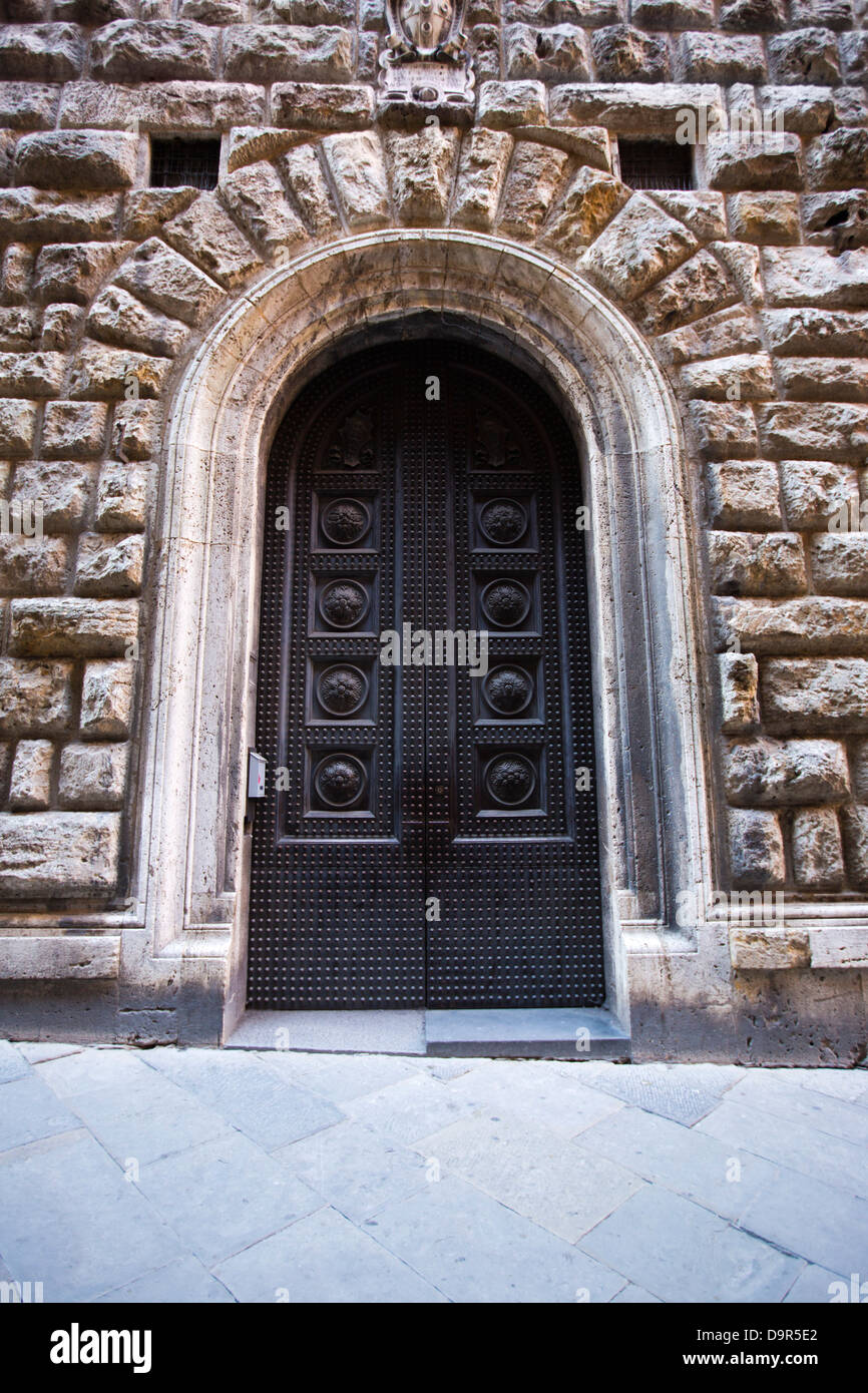 Closed door of a building, Siena, Siena Province, Tuscany, Italy Stock Photo