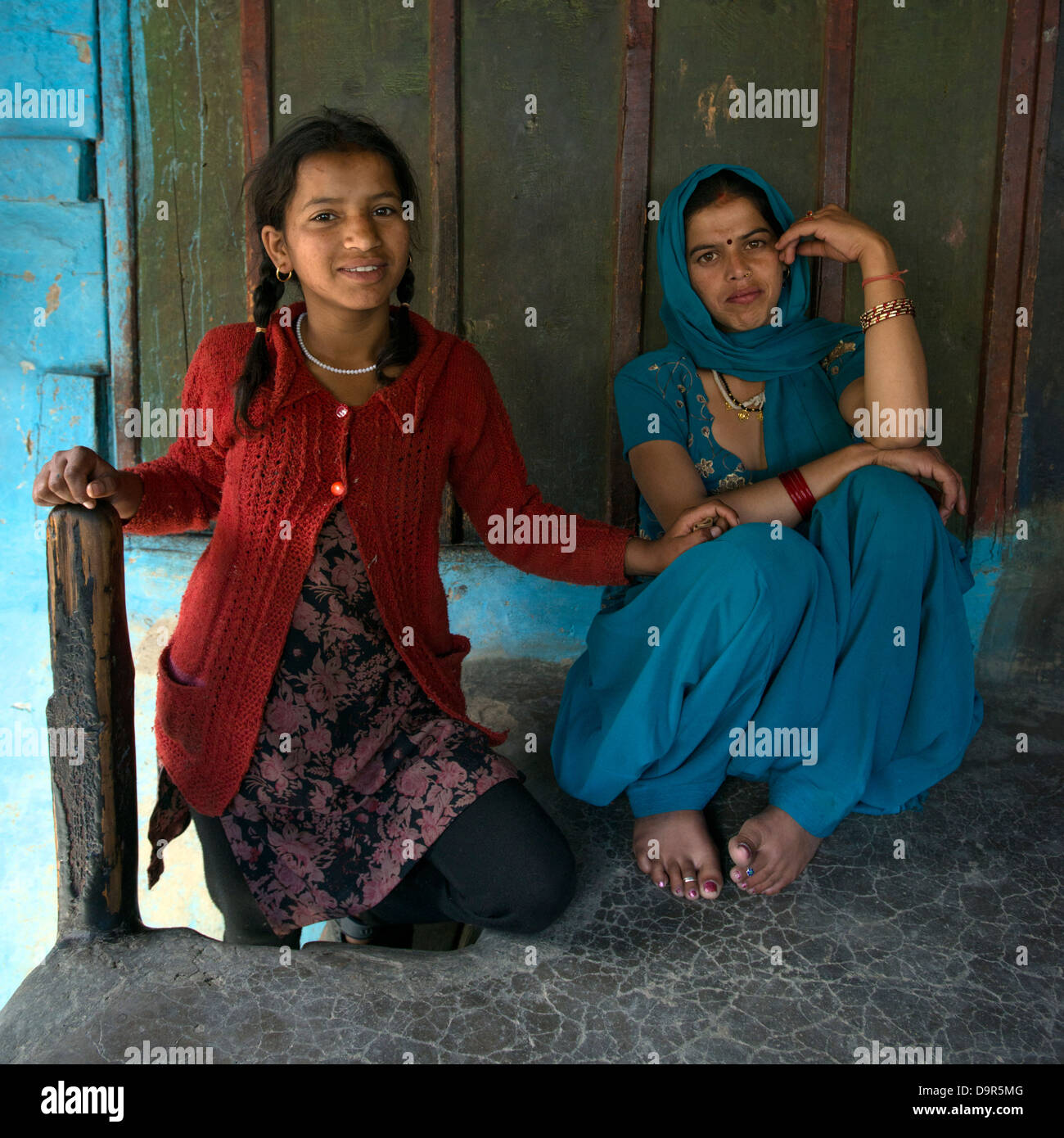 Two villagers of the Gaddi tribe pose for the camera at their house in the district of Bharmour, Himachal Pradesh, India Stock Photo