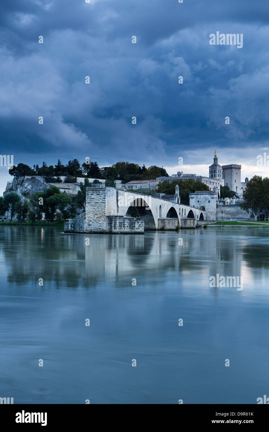 the Pont St-Bénézet, Palais des Papes & Rhone River at dusk, Avignon, Provence, France Stock Photo
