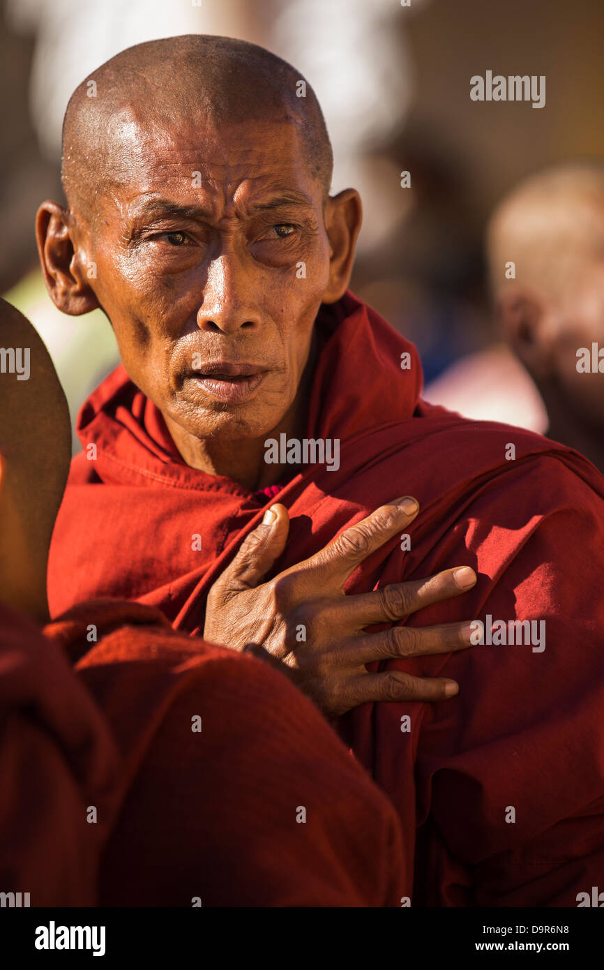 monks at the Shwezigon Paya, Bagan, Myanmar (Burma) Stock Photo