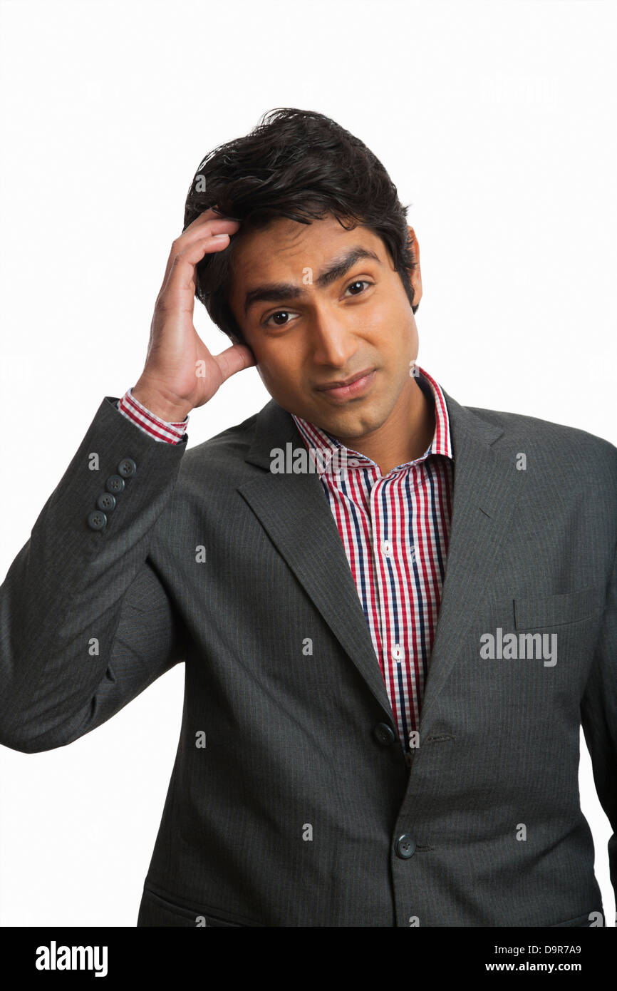 Businessman scratching his head Stock Photo