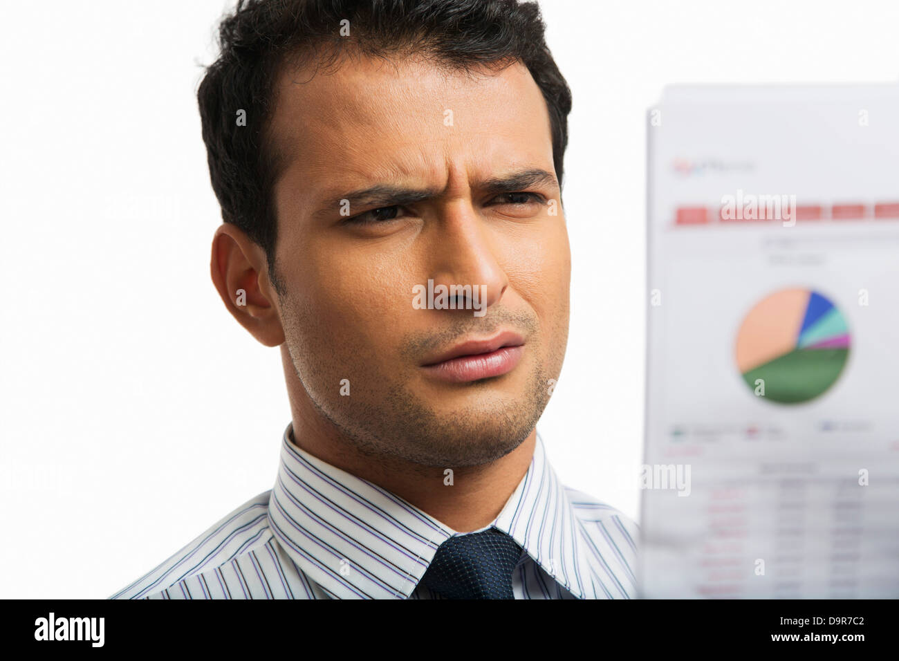 Businessman looking at a financial newspaper Stock Photo