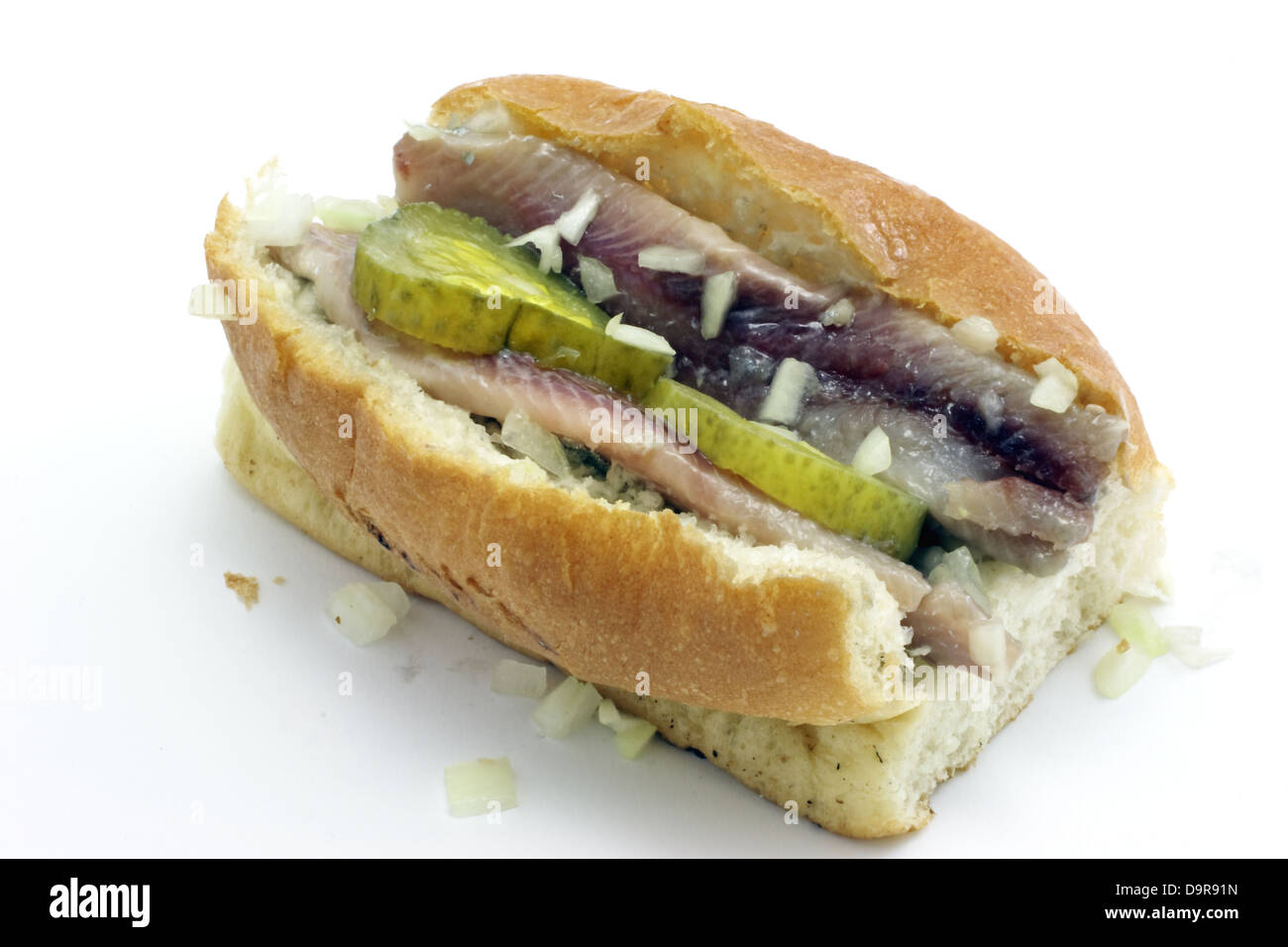 Traditional dutch herring sandwich with cucumber and onion Stock Photo