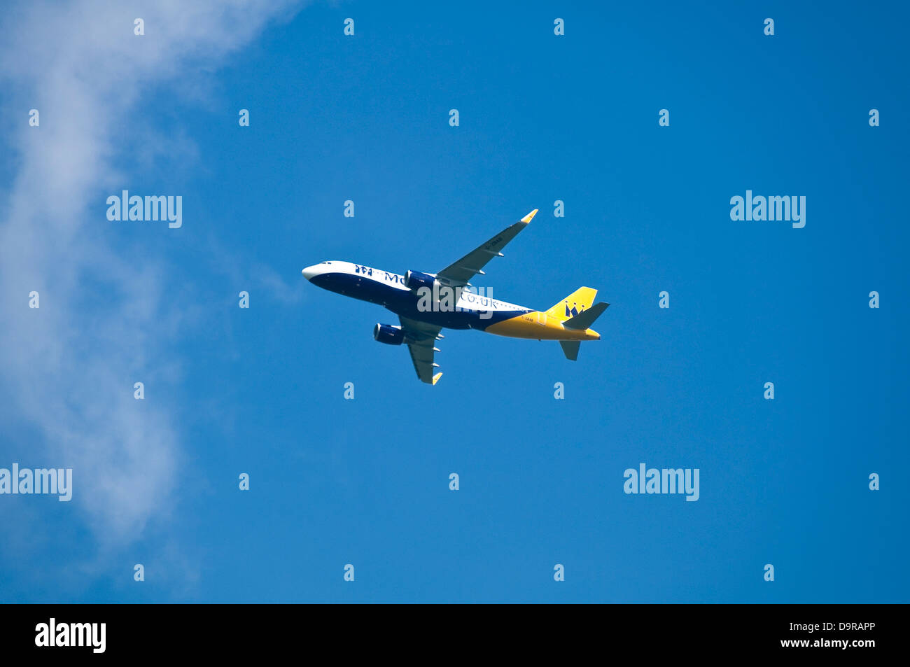 Horizontal close up of a new Monarch airlines Airbus 320 in flight. Stock Photo