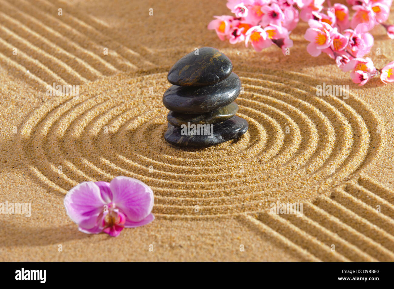 Japanese zen garden with stone in sand Stock Photo