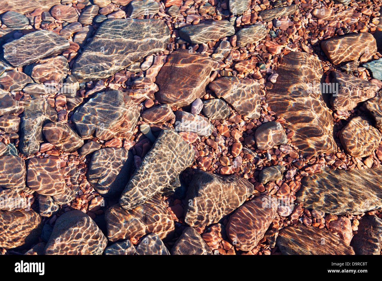 Submerged rocks beneath the flickering surface of Lake Superior, North Shore Minnesota. Stock Photo