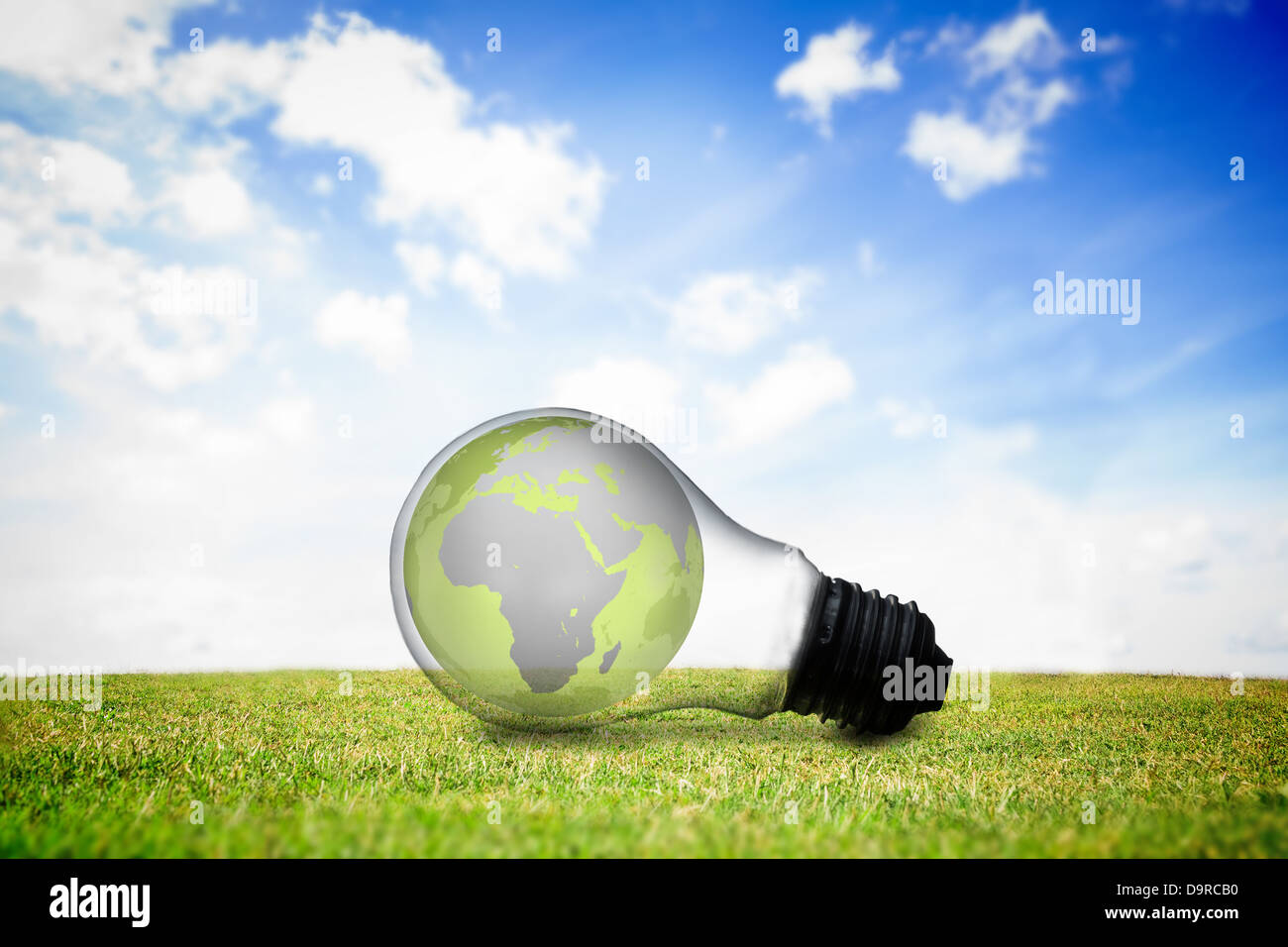 Earth inside light bulb Stock Photo