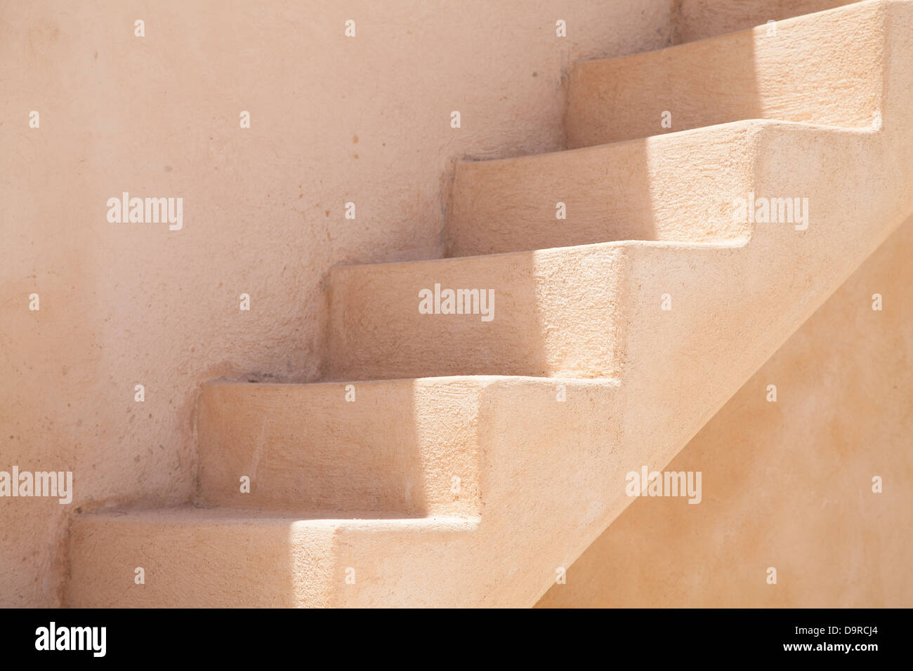 A concrete staircase beside a house in Megalochori, Santorini, Greece. Stock Photo