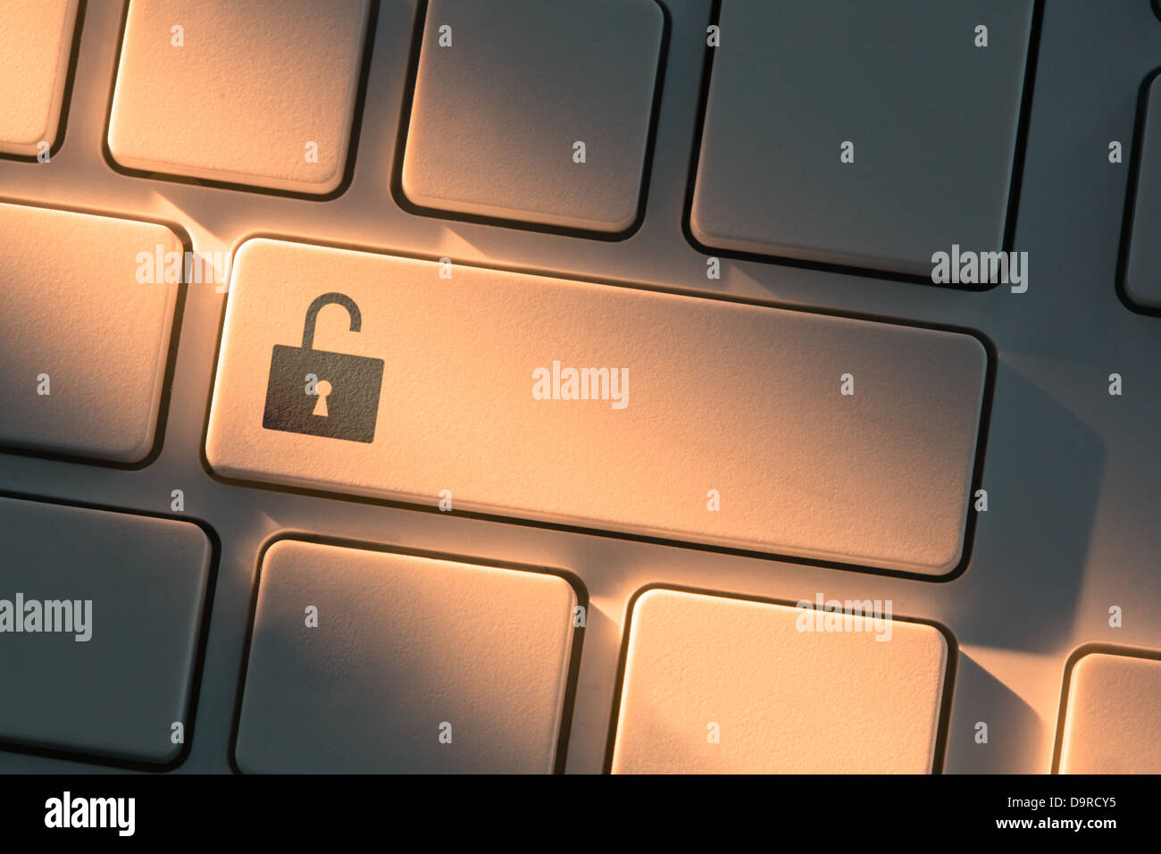 Keyboard with close up on unlock button Stock Photo