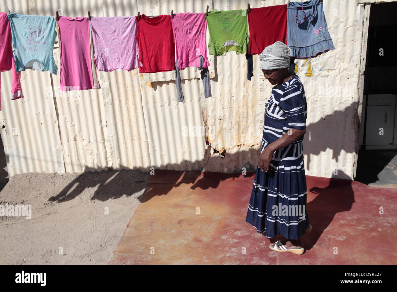 Mature Black South African Woman Hangs Her Washing Stock Photo