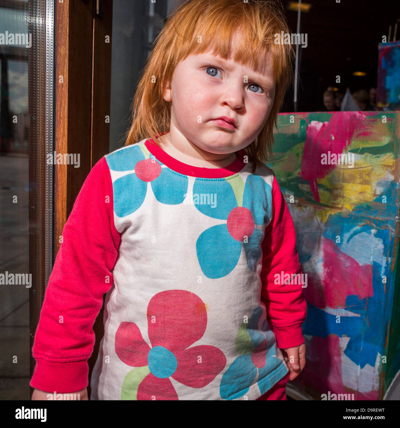 Young Red headed girl at art show for children, Reykjavik, Iceland Stock Photo