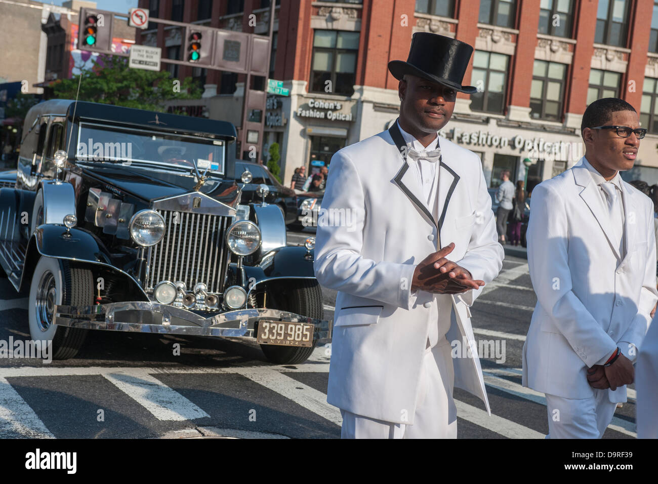 Isaiah Owens, the owner of Owens Funeral Home, in Harlem in New York driving his 1924 Rolls-Royce hearse in a procession Stock Photo
