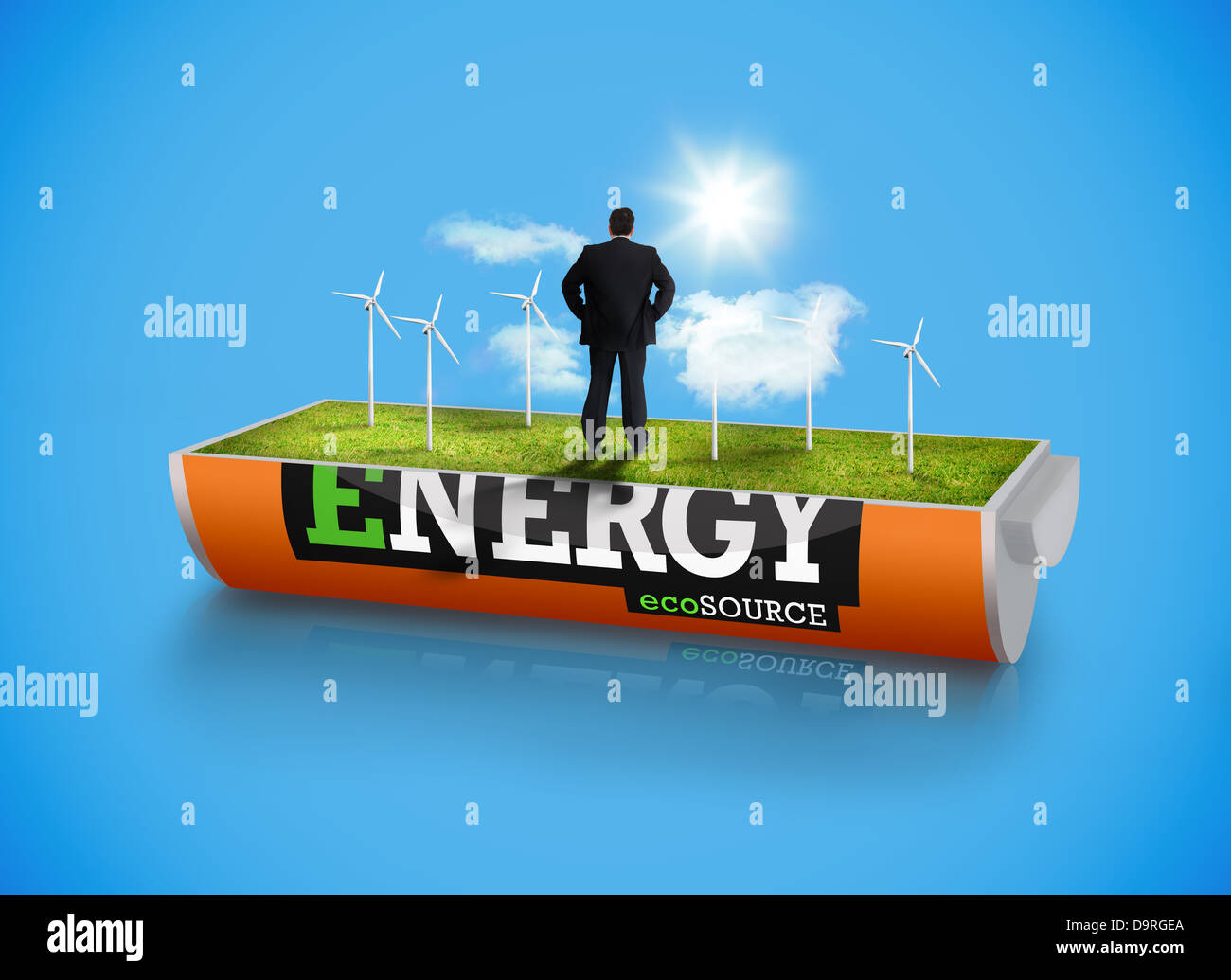 Businessman in wind turbine field in an energy saving battery Stock Photo